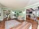 Spacious living room with hardwood floors, neutral walls, and seamless transition into other rooms at 4522 Chuckwood Dr, Mint Hill, NC 28227