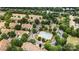 Overhead view of a neighborhood featuring townhomes, a pool, mature trees and green spaces at 4818 Grier Farm Ln, Charlotte, NC 28270