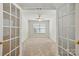 Bedroom showcasing glass french doors, neutral walls, carpet, and a ceiling fan at 4818 Grier Farm Ln, Charlotte, NC 28270