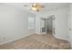 Cozy bedroom featuring carpet, neutral walls, and an adjoining room with glass French doors at 4818 Grier Farm Ln, Charlotte, NC 28270