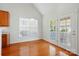 Bright breakfast nook with wood floors, large windows, and glass doors to the outside at 4818 Grier Farm Ln, Charlotte, NC 28270