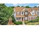 Charming two-story home with brick accents, red shutters, and a cozy front porch at 4818 Grier Farm Ln, Charlotte, NC 28270