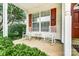 Cozy front porch with rocking chairs, offering a relaxing outdoor space at 4818 Grier Farm Ln, Charlotte, NC 28270