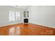 Spacious living room with hardwood floors, fireplace, and ample natural light at 4818 Grier Farm Ln, Charlotte, NC 28270