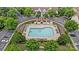 Aerial shot of a community pool with lounge chairs, surrounded by green trees at 4818 Grier Farm Ln, Charlotte, NC 28270