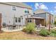 Inviting backyard featuring a patio with outdoor seating, a fire pit, and well-manicured landscaping at 5030 Lily Pond Cir, Waxhaw, NC 28173