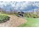 Scenic covered bridge surrounded by lush greenery, offering a charming and tranquil community landmark at 5030 Lily Pond Cir, Waxhaw, NC 28173