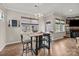 Eat-in kitchen with modern table and chairs, stylish light fixture, and abundant natural light at 5030 Lily Pond Cir, Waxhaw, NC 28173