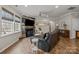 Inviting living room with a unique fireplace and comfortable seating, perfect for relaxation and entertainment at 5030 Lily Pond Cir, Waxhaw, NC 28173
