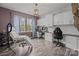 Versatile home office space with abundant natural light, built-in cabinets and views of the yard at 5030 Lily Pond Cir, Waxhaw, NC 28173
