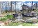 Picturesque waterfall cascading into a serene pond, enhancing the community's natural beauty and appeal at 5030 Lily Pond Cir, Waxhaw, NC 28173