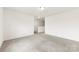 A neutral bedroom shows light walls, a light colored carpet, and white baseboards at 5108 Puclerton Dr, Charlotte, NC 28215