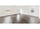 Spacious bedroom featuring hardwood flooring and large windows offering plenty of natural light at 5108 Puclerton Dr, Charlotte, NC 28215
