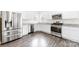 Well-lit kitchen featuring stainless steel appliances, granite countertops, and ample cabinet space at 5108 Puclerton Dr, Charlotte, NC 28215