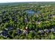 Aerial view of property near Challis Lake, Carmel Country Club and Uptown Charlotte at 5811 Old Well House Rd, Charlotte, NC 28226