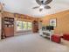 Large bonus room includes an office area, TV, carpet and natural light at 5811 Old Well House Rd, Charlotte, NC 28226
