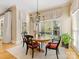 Cozy dining area with natural light, wood floors, and an elegant chandelier at 5811 Old Well House Rd, Charlotte, NC 28226