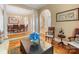 Elegant living room with hardwood floors and open access to dining and staircase at 5811 Old Well House Rd, Charlotte, NC 28226