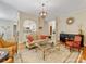 Open-concept living room with hardwood floors, a decorative rug, and a view into the adjacent kitchen at 5811 Old Well House Rd, Charlotte, NC 28226