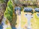 Aerial view of property showcasing manicured lawns, mature trees, and driveway at 6199 Timberlane Ter, Hickory, NC 28601