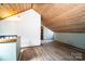 Open attic space with wood ceiling, light-colored walls, and wood-look flooring offers versatility at 6199 Timberlane Ter, Hickory, NC 28601