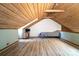 Finished attic space featuring wood floors and a television at 6199 Timberlane Ter, Hickory, NC 28601