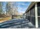 Relaxing back deck overlooking a leafy green yard and enclosed porch area at 6199 Timberlane Ter, Hickory, NC 28601