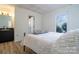 Cozy bedroom with plush bedding, stylish vanity, and ample natural light at 6199 Timberlane Ter, Hickory, NC 28601