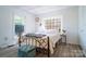 Bright bedroom featuring a cozy bed, decorative window, and a stylish ottoman at 6199 Timberlane Ter, Hickory, NC 28601