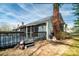 Rear view of a two-story home with a deck and screened porch showcasing backyard at 6199 Timberlane Ter, Hickory, NC 28601