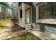Charming entrance with brick pathway leading to a classic, covered front door with stained glass window at 6199 Timberlane Ter, Hickory, NC 28601