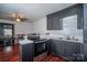 Updated kitchen featuring stainless steel appliances, dark cabinets, and sleek countertops at 6199 Timberlane Ter, Hickory, NC 28601