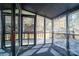 Inviting screened porch featuring black painted flooring and screens for enjoying the outdoors at 6199 Timberlane Ter, Hickory, NC 28601
