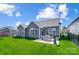 Expansive backyard with a patio, grill, and outdoor seating area, perfect for entertaining or relaxing outdoors at 6276 Artigas Dr, Fort Mill, SC 29707