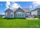 Well-maintained backyard featuring a patio and table with chairs on a bright, sunny day at 6276 Artigas Dr, Fort Mill, SC 29707
