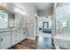 A bathroom with granite countertops, a glass shower enclosure, and sleek gray cabinetry at 6276 Artigas Dr, Fort Mill, SC 29707