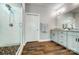 This bathroom features granite countertops, a glass shower, and tiled floors for easy maintenance at 6276 Artigas Dr, Fort Mill, SC 29707