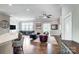 Open-concept living area with hardwood floors, neutral walls, and ample natural light from the many windows at 6276 Artigas Dr, Fort Mill, SC 29707