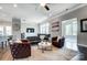 Stylish living room with comfortable seating, hardwood floors, and a ceiling fan for added comfort at 6276 Artigas Dr, Fort Mill, SC 29707