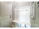 Mudroom with bench seating, hooks, and storage, providing a convenient and organized entryway space at 6276 Artigas Dr, Fort Mill, SC 29707