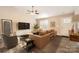 Bright living room showcasing a comfortable leather couch, modern furnishings, and sleek wood floors at 714 Sunset Dr, Salisbury, NC 28147