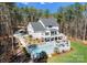Expansive backyard featuring a sparkling pool, patio, and lush landscaping, perfect for outdoor living at 7322 Bay Ridge Dr, Denver, NC 28037