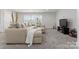 Finished basement featuring carpet flooring, neutral colored furniture and a tv at 7322 Bay Ridge Dr, Denver, NC 28037