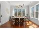 Bright dining room with hardwood floors, large windows, and contemporary lighting fixtures at 7322 Bay Ridge Dr, Denver, NC 28037