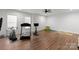 Spacious home gym with laminate floors, workout equipment and natural light at 7322 Bay Ridge Dr, Denver, NC 28037