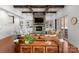 Inviting living room with a stone fireplace, beamed ceiling, and built-in shelving at 7322 Bay Ridge Dr, Denver, NC 28037
