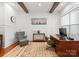 Comfortable home office featuring hardwood floors, wainscoting, and a wood desk at 7322 Bay Ridge Dr, Denver, NC 28037