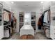 Spacious walk-in closet with custom shelving, center island and carpet flooring at 7322 Bay Ridge Dr, Denver, NC 28037