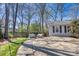 Backyard view with patio, outdoor seating, lush greenery, and mature trees, perfect for outdoor enjoyment at 842 Mary Knoll Ct, Rock Hill, SC 29730
