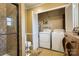 Bathroom includes a tiled shower, a toilet, and washer/dryer hookups behind closet doors at 842 Mary Knoll Ct, Rock Hill, SC 29730